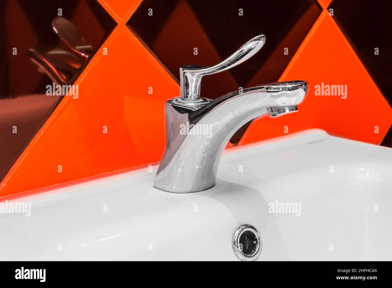 Steel faucet and sink home hygiene kitchen or bathroom. Stock Photo