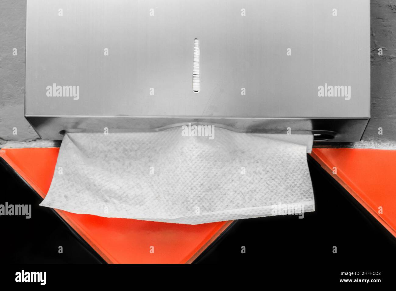 Paper Towel Dispenser Cleanliness and Hygiene Wipes in a Public Toilet