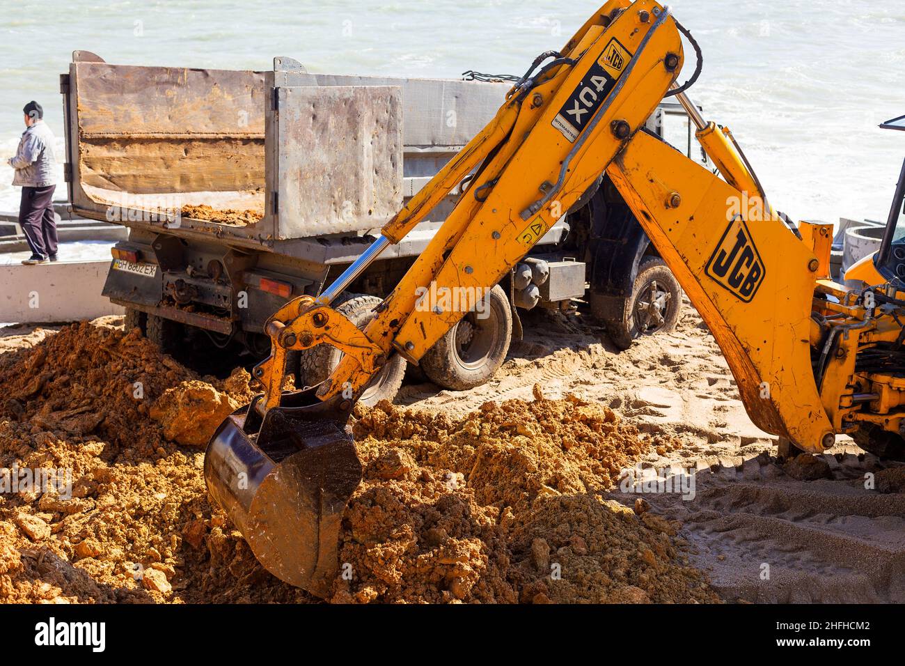 ODESSA, UKRAINE 17 October 2016 Excavator digs sand on a sea beach