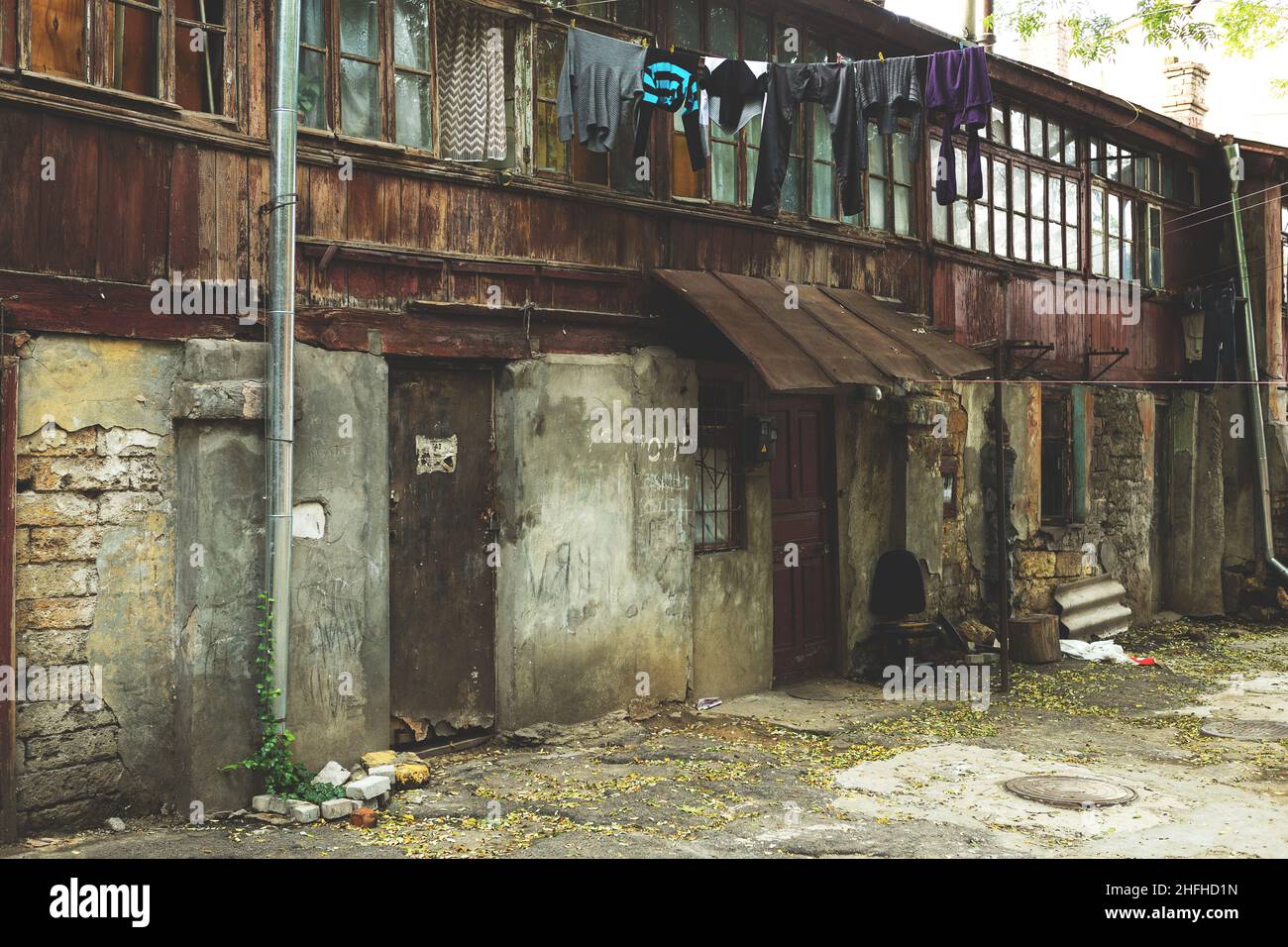 Tinted landscape of destroyed homes in a poor quarter for the poor people. Stock Photo