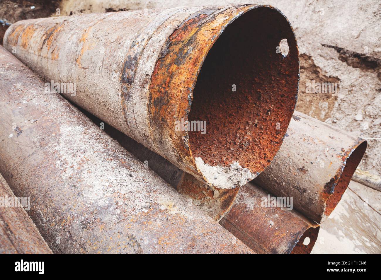 Fragments of old large water pipes. After many years of operation