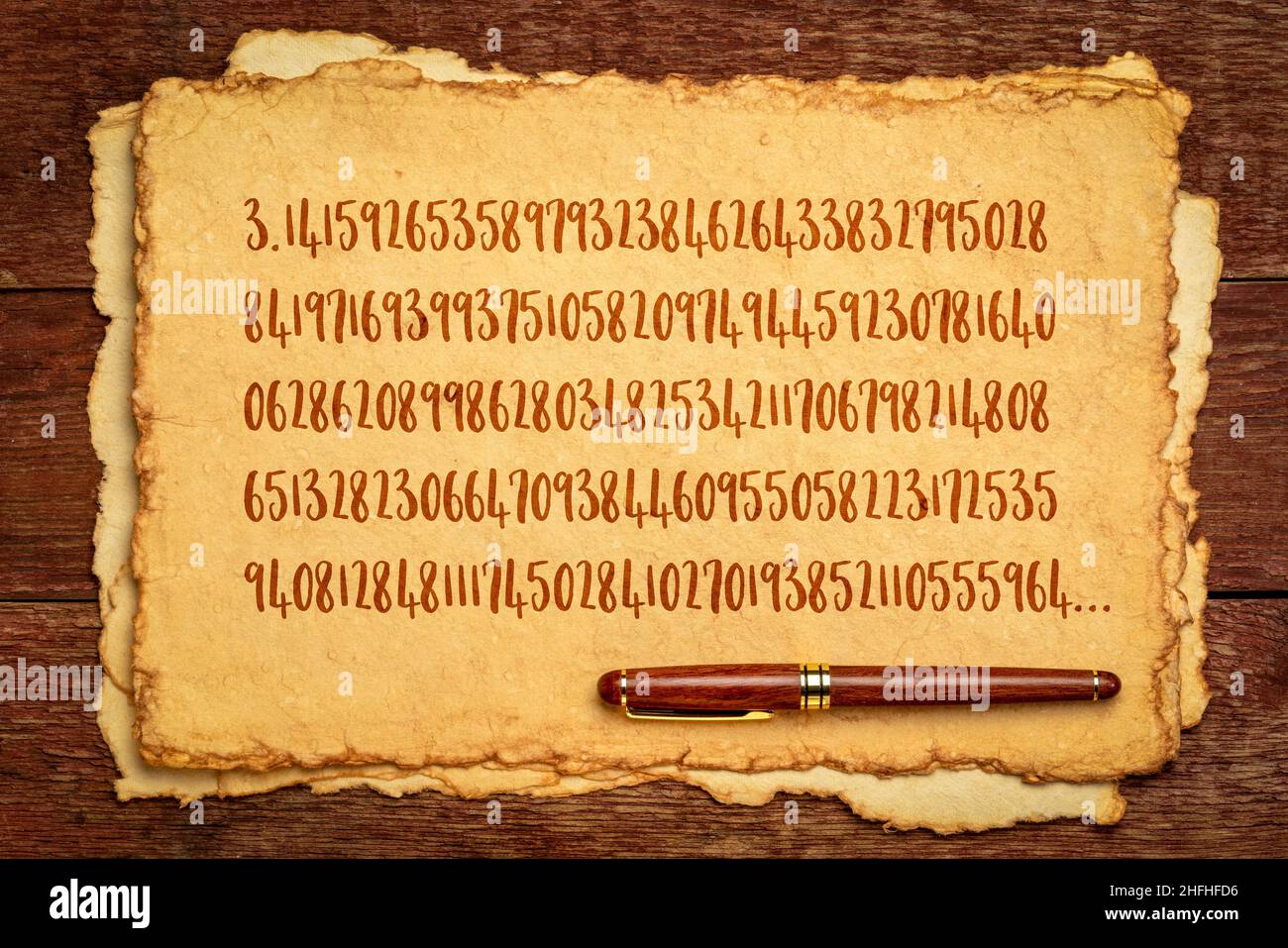 number pi 3.1415 with 140 decimal places - handwriting on a retro handmade paper, mathematics and pi day concept Stock Photo