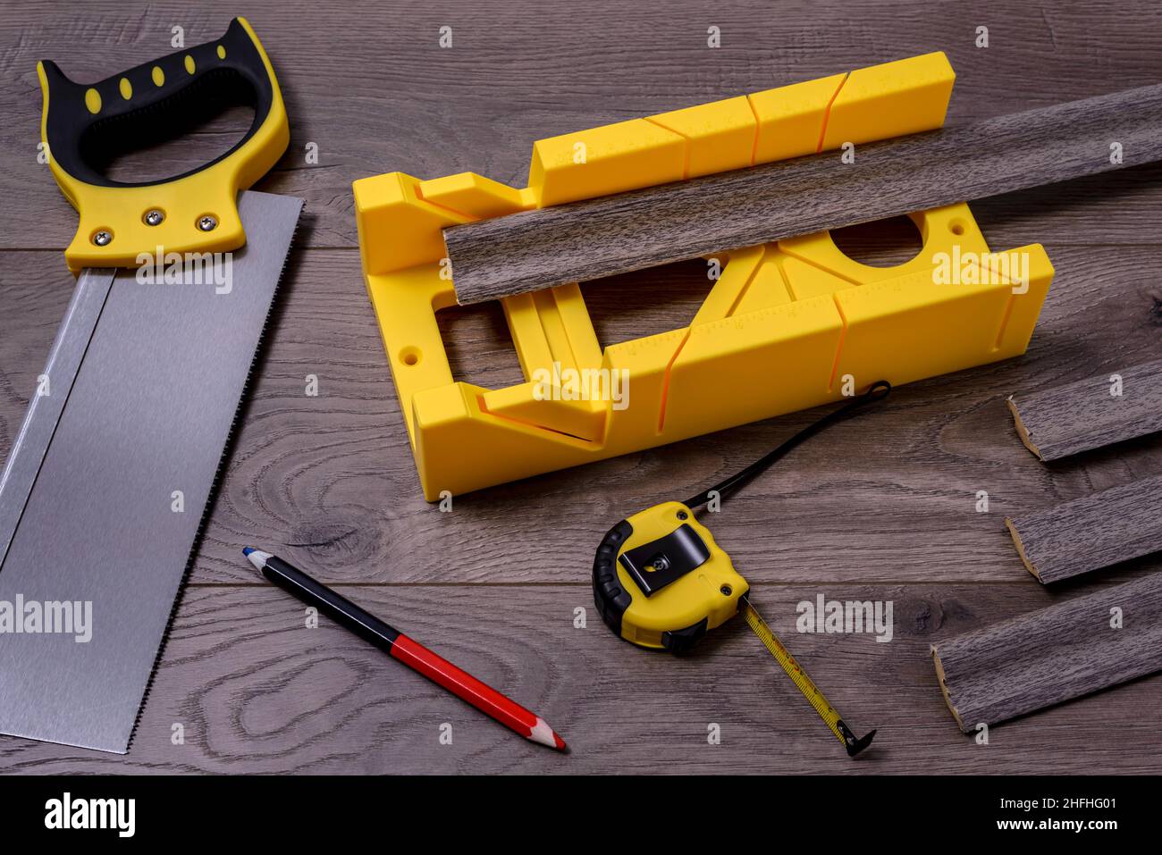 Construction tool miter saw with miter box on a laminate floor