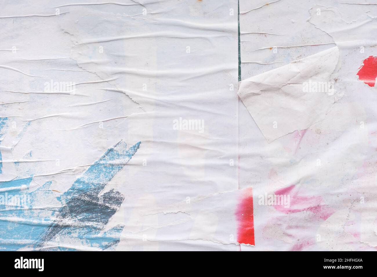 Shabby and messy crumpled and torn poster paper texture as graphic design  element background, white paper scraps glued to a wall Stock Photo - Alamy