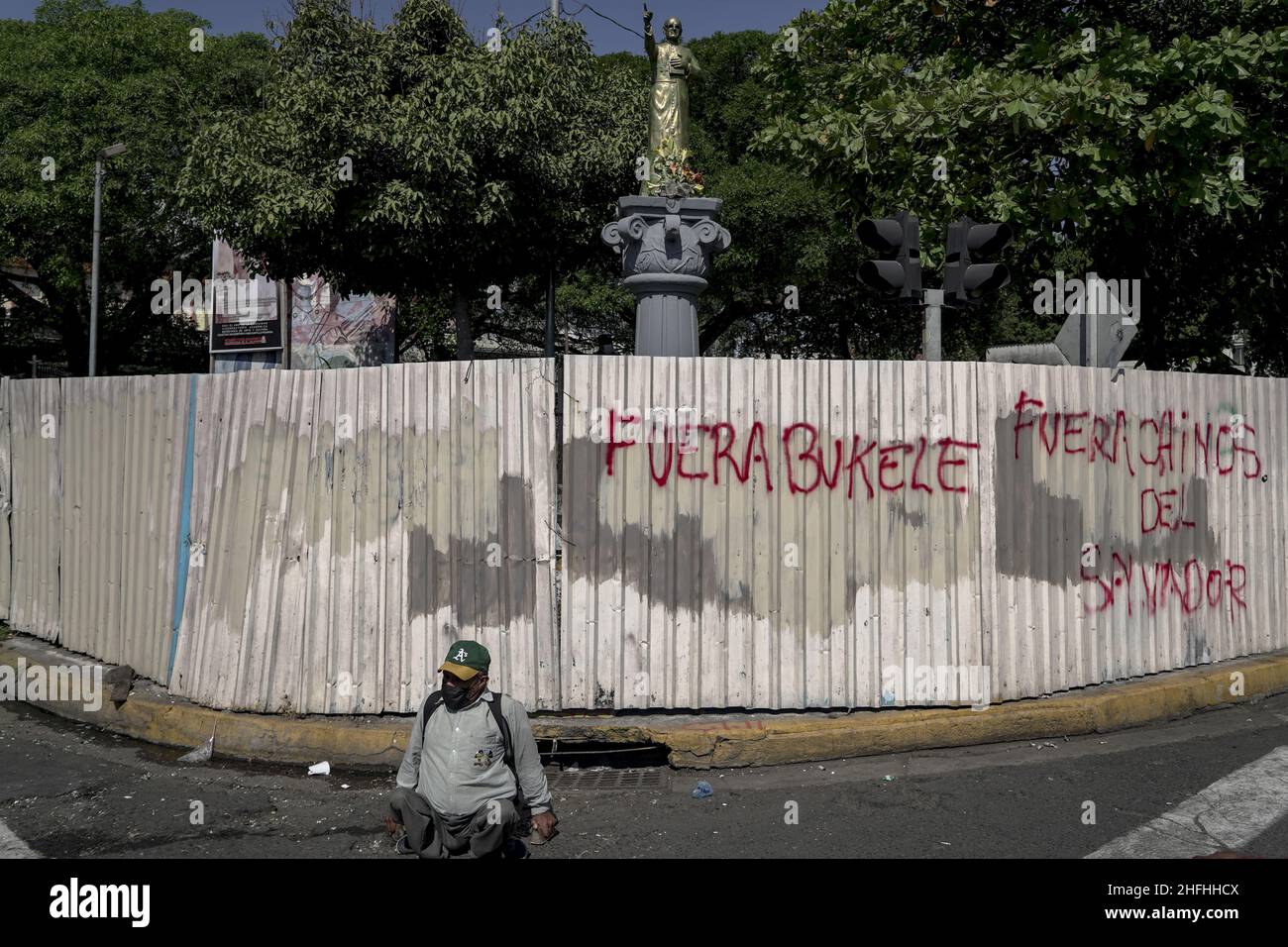 A physically impaired man sits next to a wall with a graffiti that says 'Bukele out' during a march of war veterans and social movements to protest against the authoritarian policies of the Salvadoran government on the 30th anniversary of the signing of the peace accords.In 1992 El Salvador put an end to a 12 year war with a peace treaty signed in Mexico between the Salvadoran government and former guerrilla Frente Farabundo Martí para la Liberación Nacional (FMLN). President of El Salvador Nayib Bukele through his party in Congress voted a law to remove the anniversary as a national day. (Pho Stock Photo