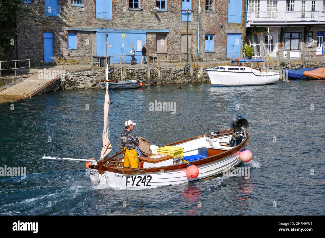 Fishing boat returning to harbour, Looe, Cornwall, England, United Kingdom Stock Photo