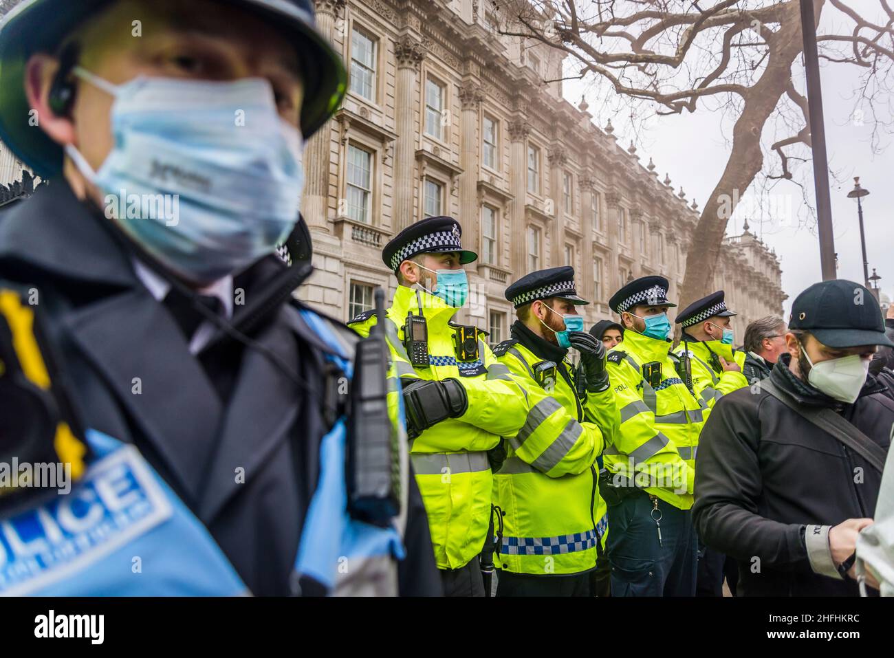 A line of police officers on the Whitehall during 'Kill the Bill' demonstration. London, England, UK 15.01.2022 Stock Photo