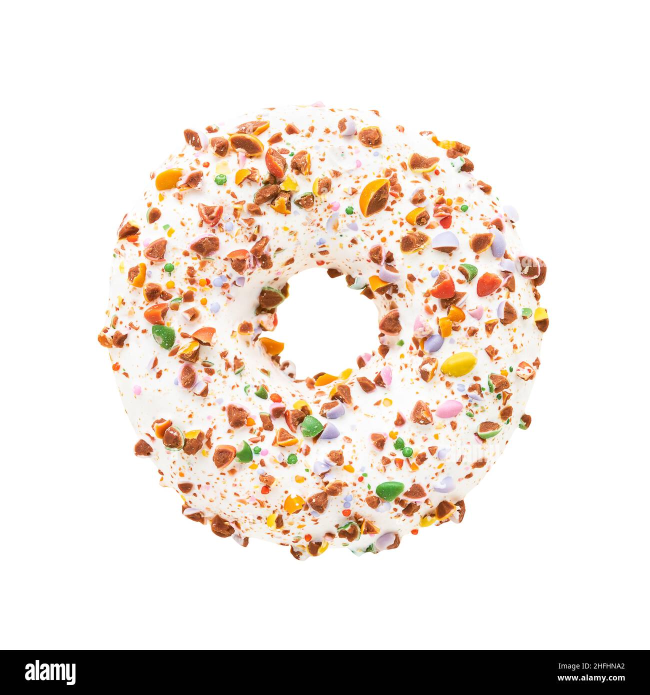 Candy Donut in white glaze with colorful candy sprinkles isolated over white background with clipping path. Stock Photo