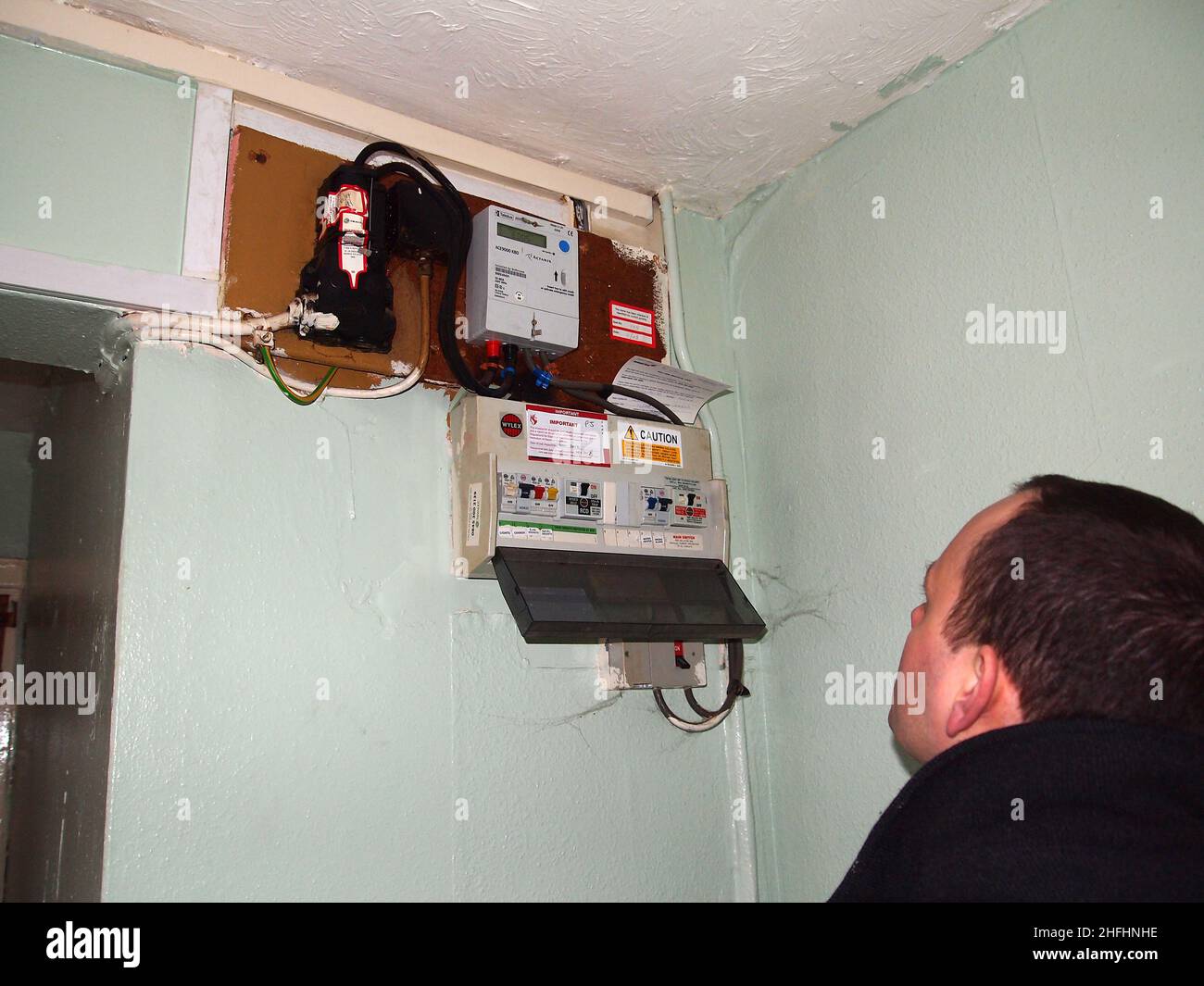 January 2013 - Poor quality electrical installation is an old block of flats and apartments Stock Photo