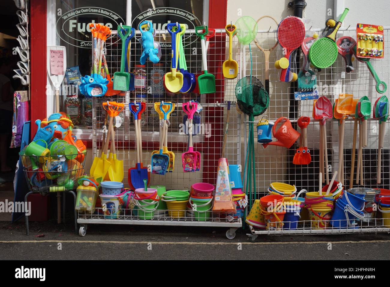 Buckets and spades outside the front of a traditional seaside shop in