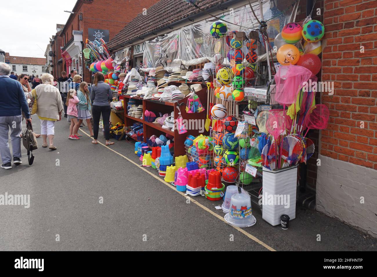 Buckets and spades outside the front of a traditional seaside shop in