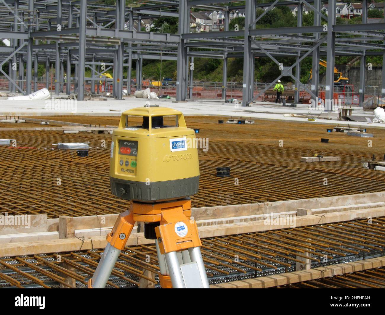 August 2011 - Contractors surveying and levelling equipment on a tripod adjacent to a works area ready to receive the deliveries of wet concrete Stock Photo