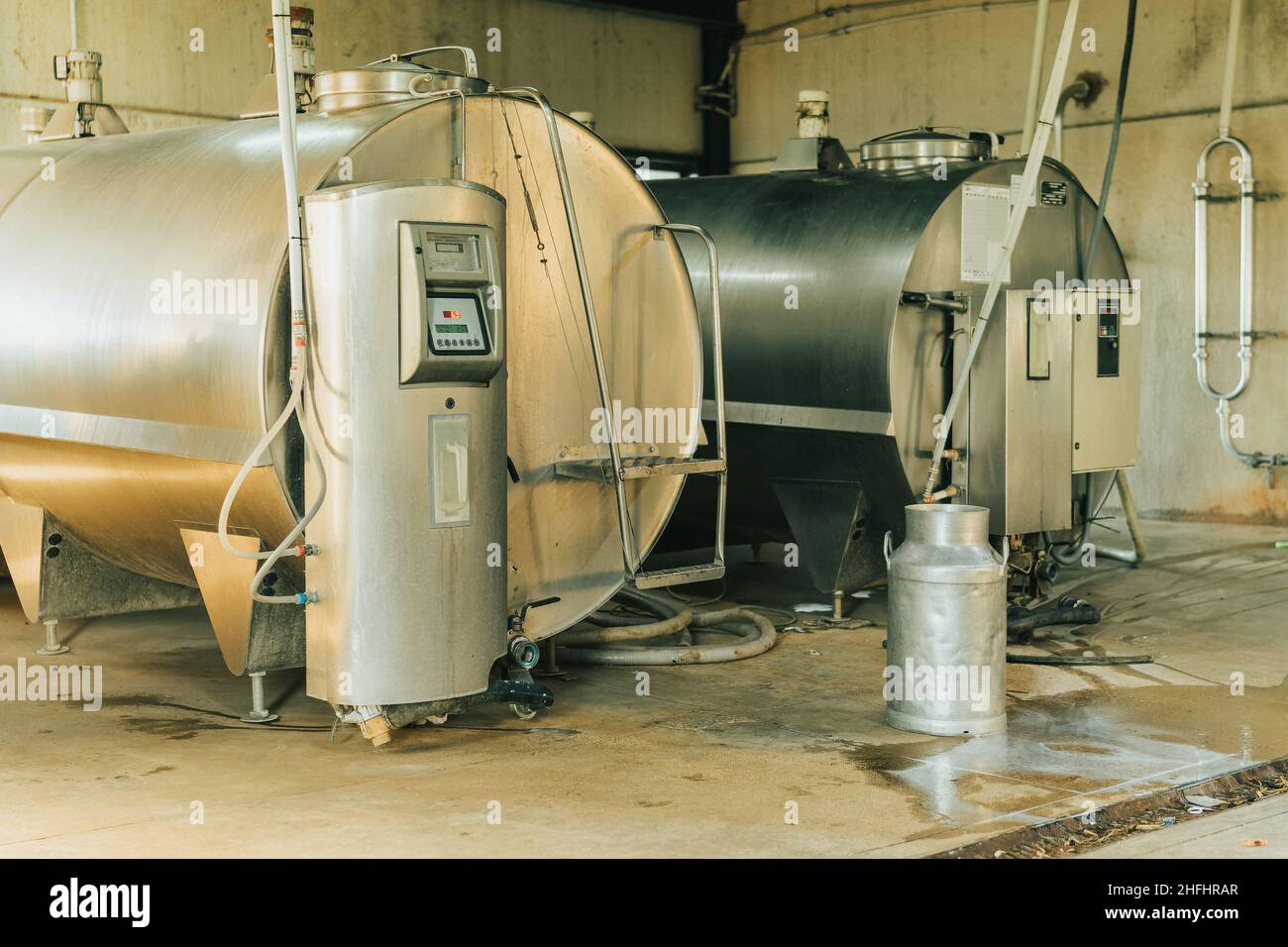 couple of milk containers storing milk milked from cows Stock Photo Alamy