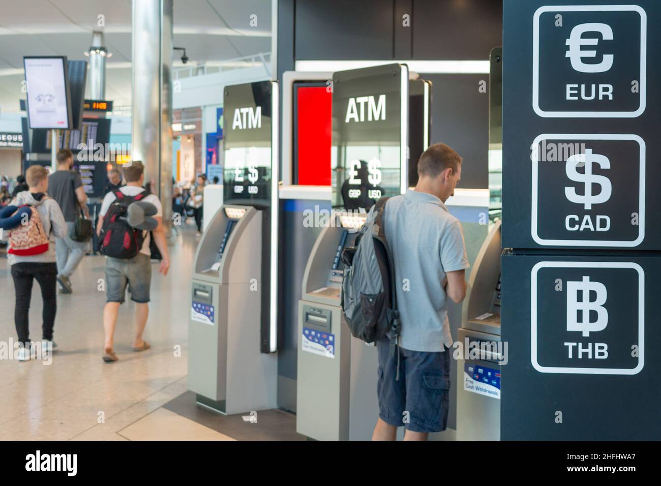 Airport ATM offering multiple currencies Stock Photo
