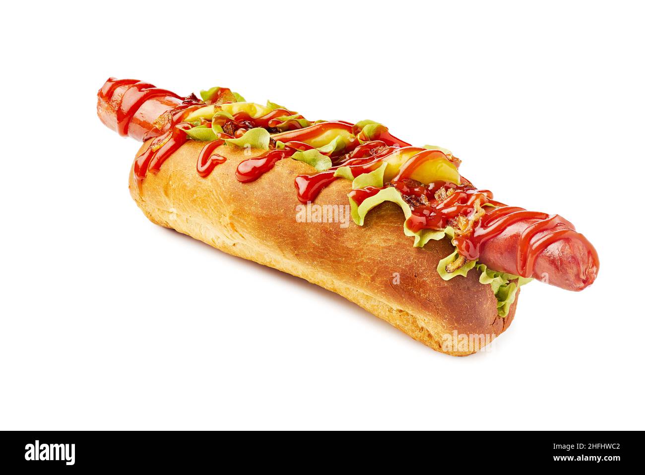 Hotdog with huge sausage, lettuce and pickled peppers on white Stock Photo