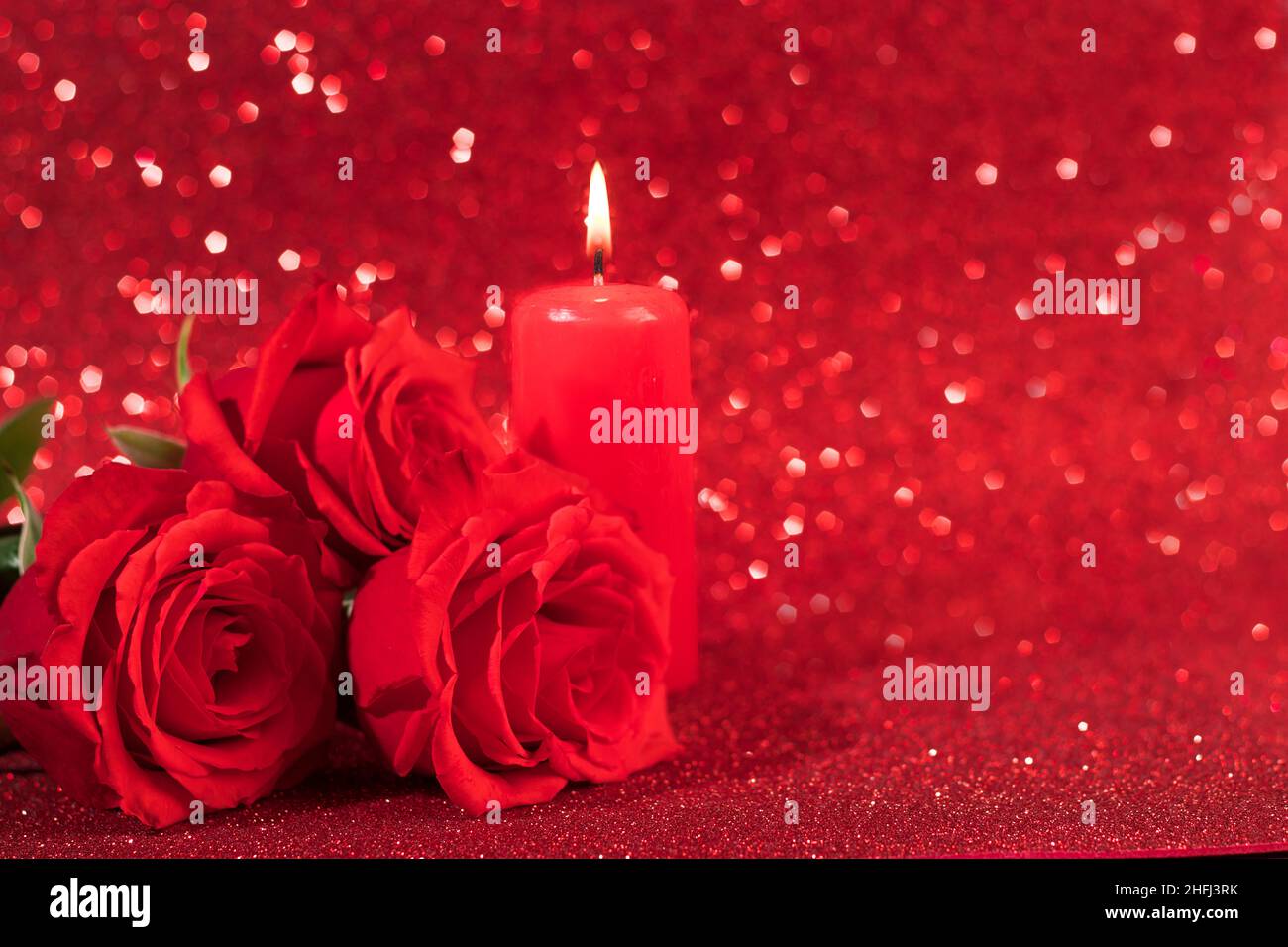 Red roses and candle for valentine's day. Romantic concept, dinner for