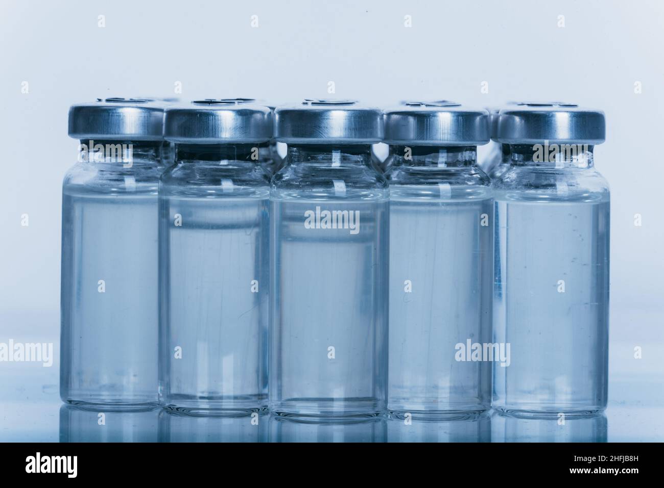 Glass medical ampoule vial for injection. Medicine is dry white drug ...