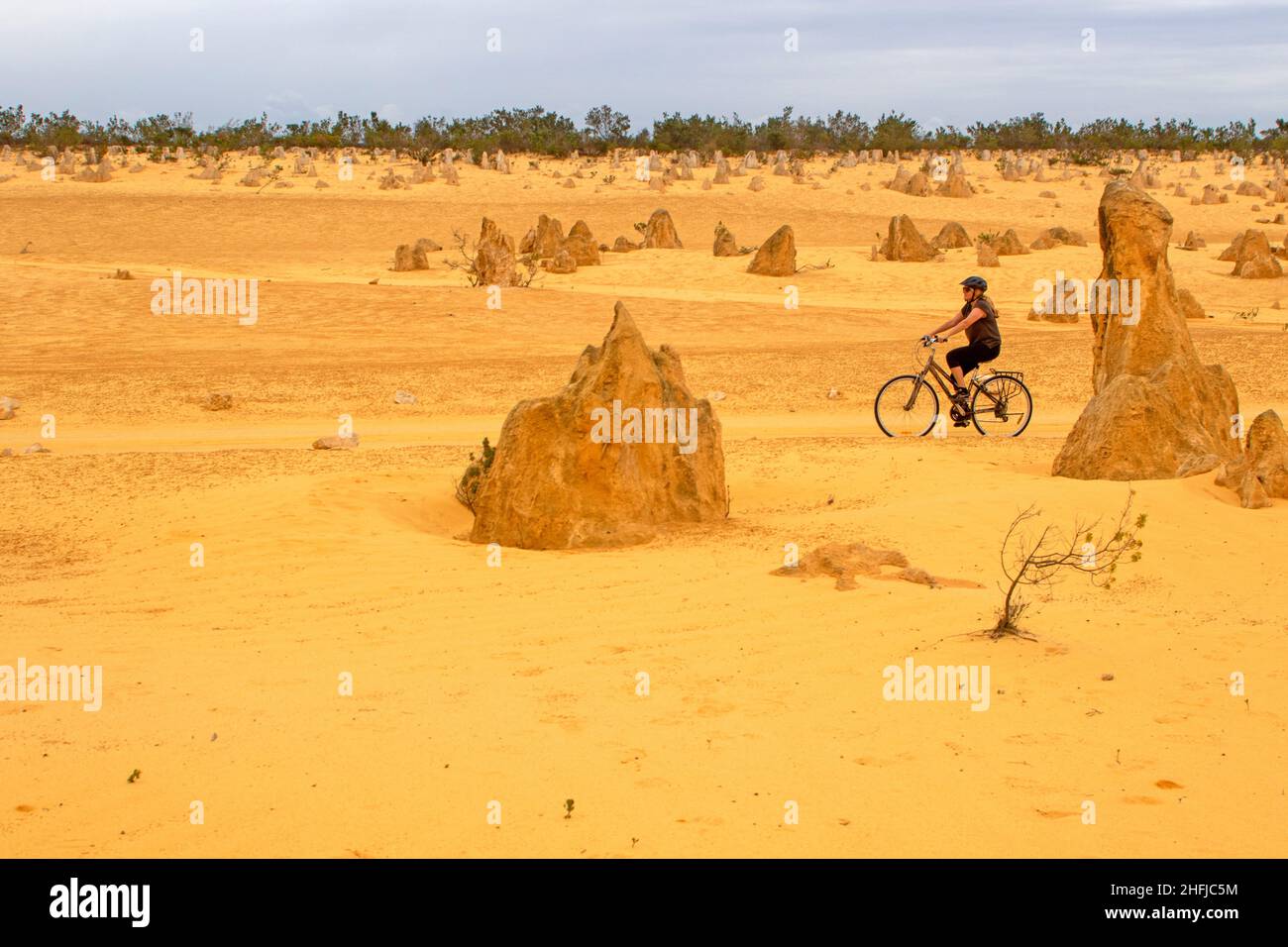 Cycling through the Pinnacles Desert Stock Photo
