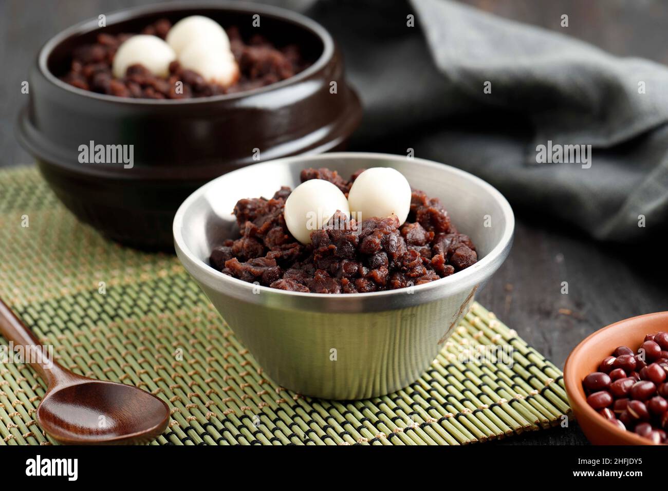 Korean Dongji Red Bean Porridge with Rice Cake on Stainless Bowl Stock Photo