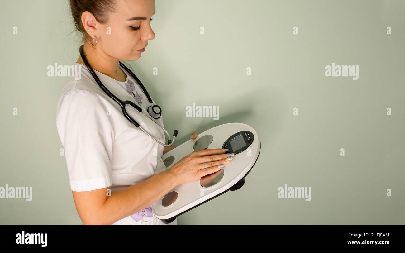 Weighing and measuring body composition. Analysis of body composition Stock Photo