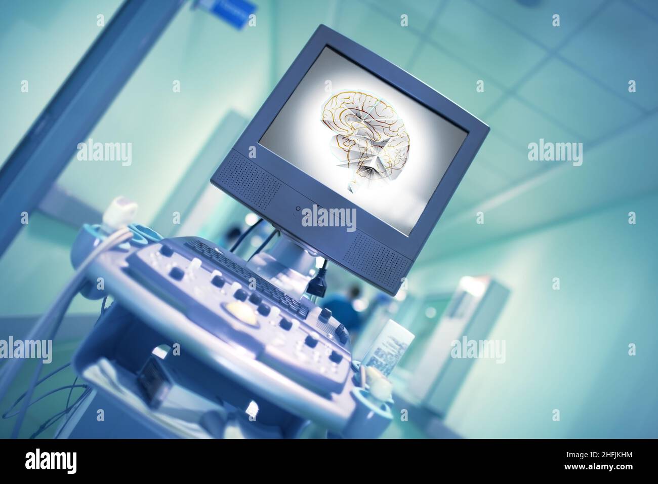 Human brain image on the display of medical equipment in the hospital corridor with blurred in motion silhouette of walking doctor. Stock Photo