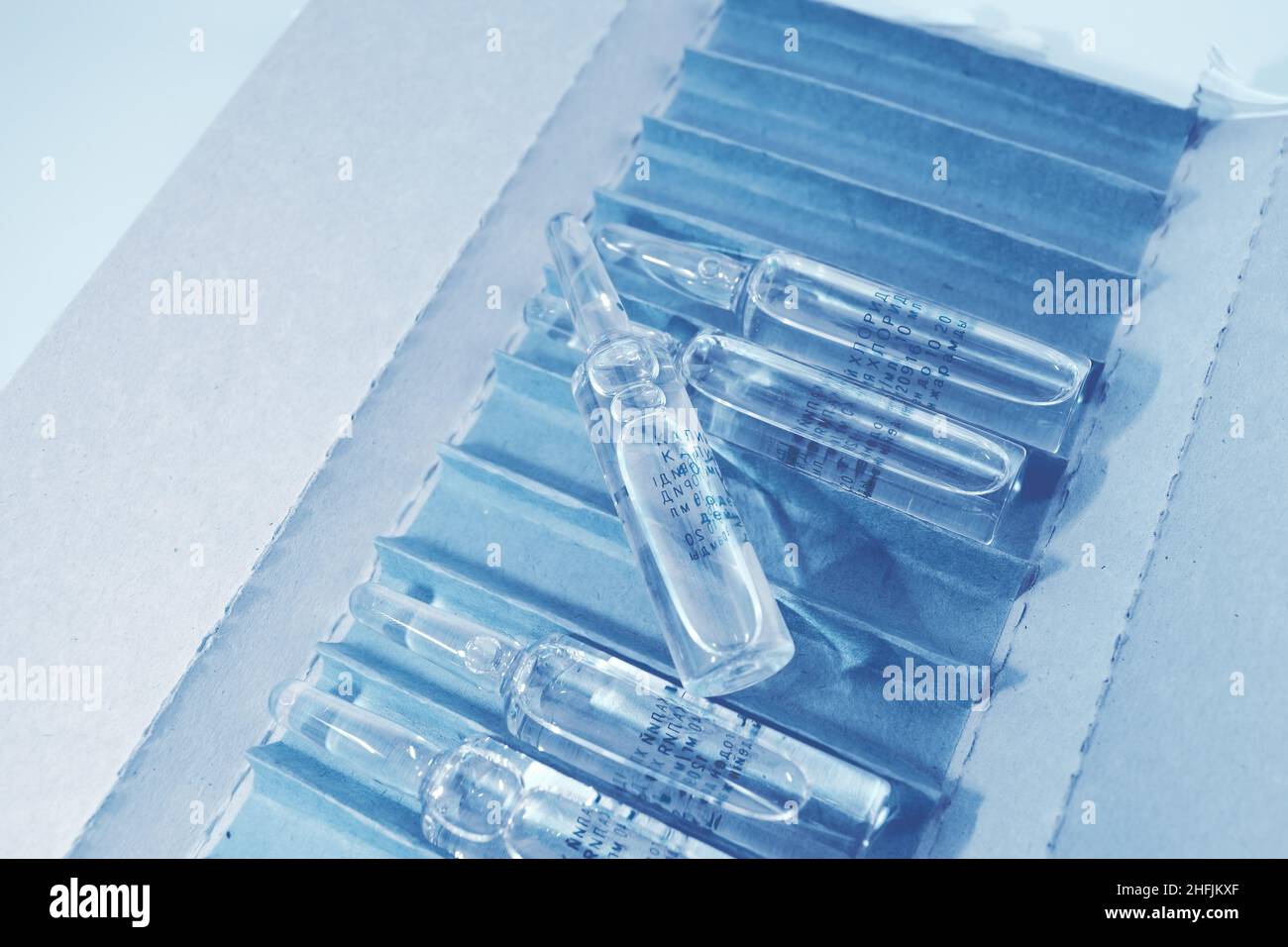 Open pack of drug ampoules, medical background with space for your