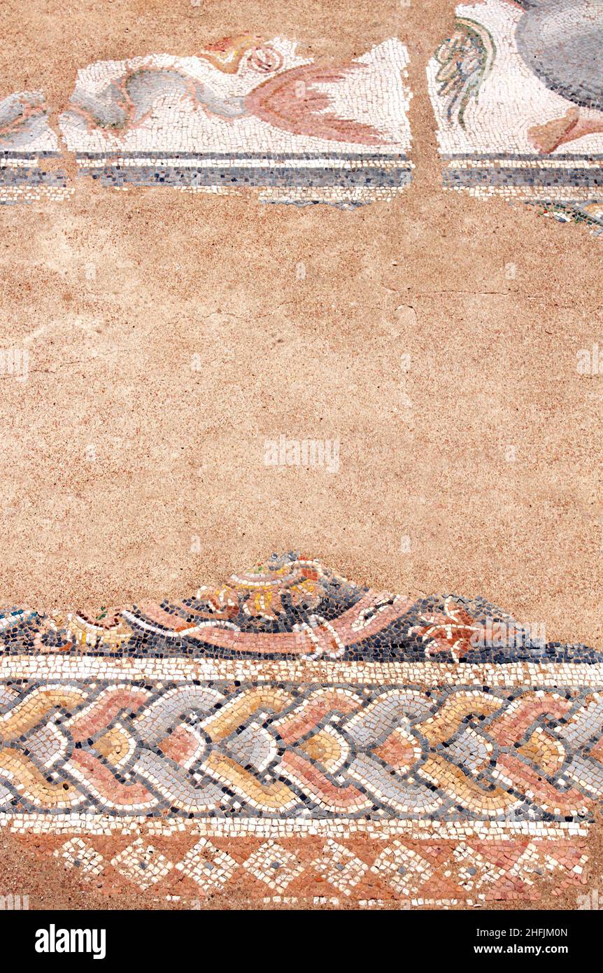 Fragment of antique mosaic at The Great Baths, Dion, Pieria, Greece. Ancient mosaic frame with copy space for text Stock Photo