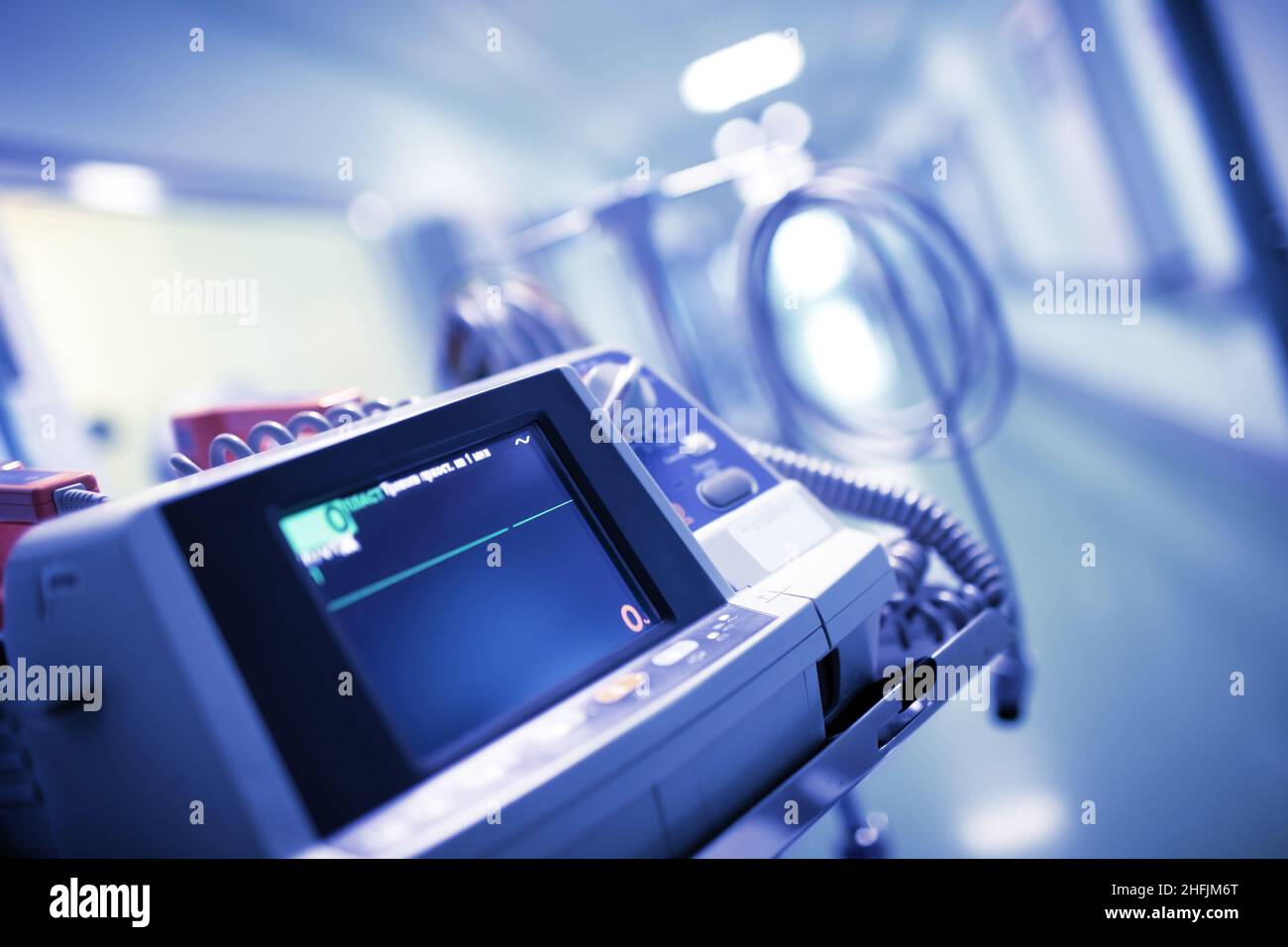 Straight line with no ECG waves on the monitor in the hospital department, concept of patient clinical death. Stock Photo