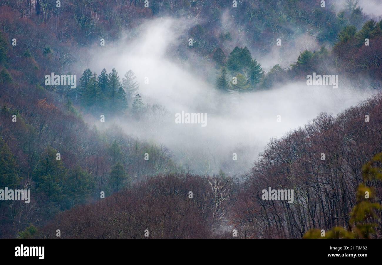 Valley mist - a wintry landscape in the Taconic Mountains, as viewed from the summit atop Bash Bish Falls towards Copake Falls. Stock Photo