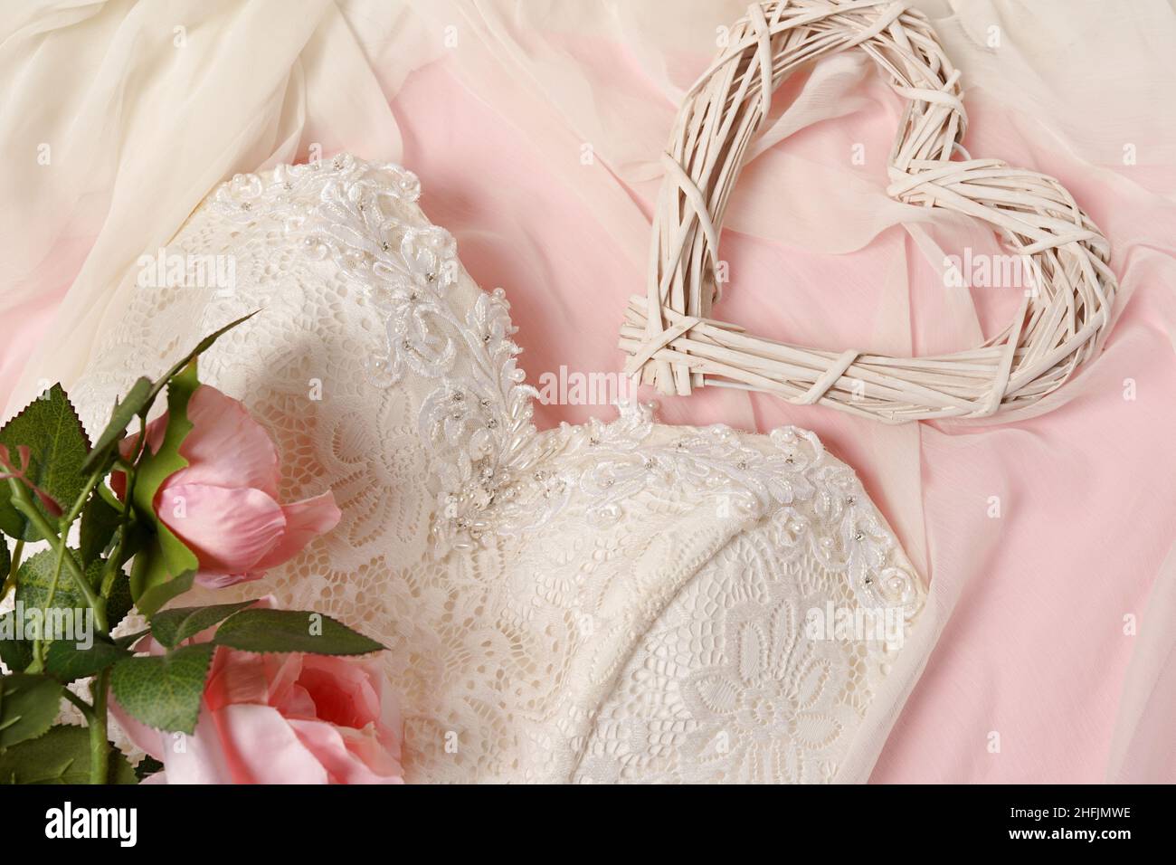 Wedding background with heart, flowers roses and elegant white dress