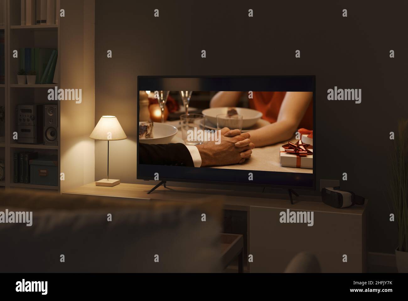 Romantic comedy movie streaming on TV and living room interior Stock Photo