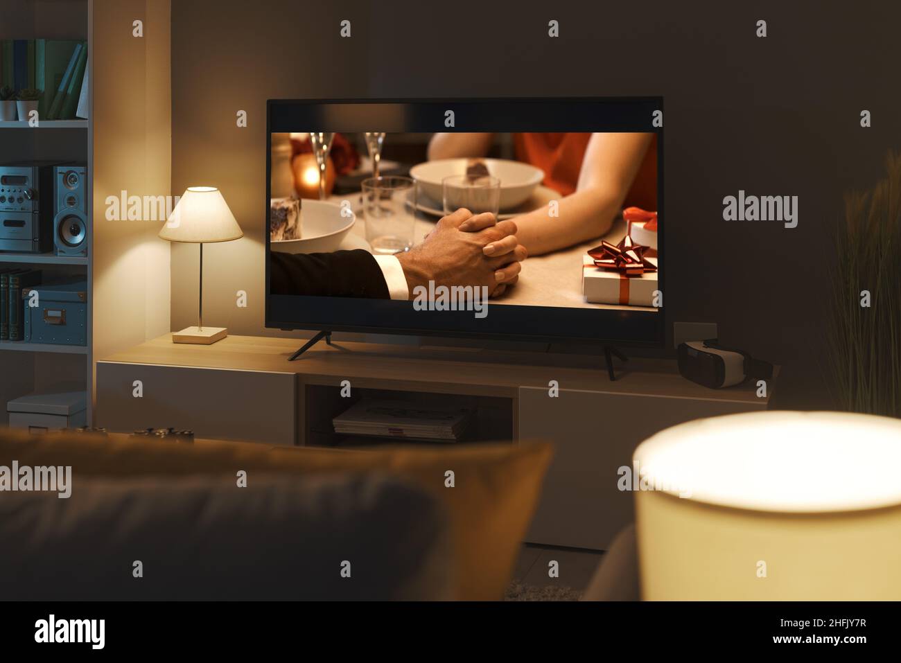 Romantic comedy movie streaming on TV and living room interior Stock Photo