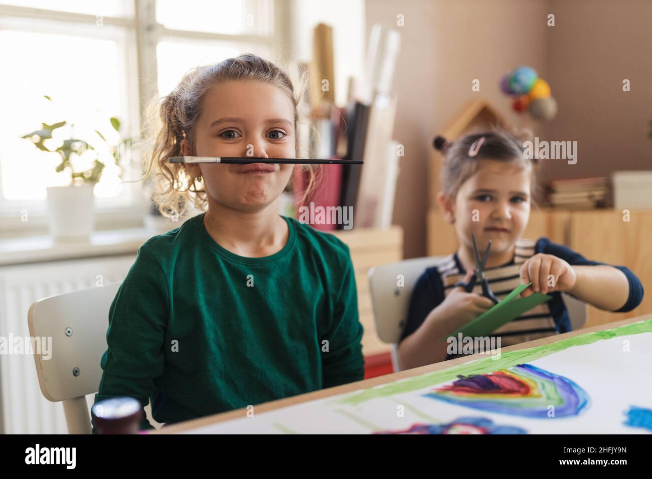 Happy little girl with her friends preparing for art class indoors at school Stock Photo Alamy