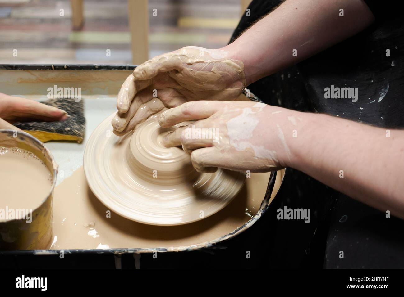 Clay modeling training on a potters wheel, clay master class. Art