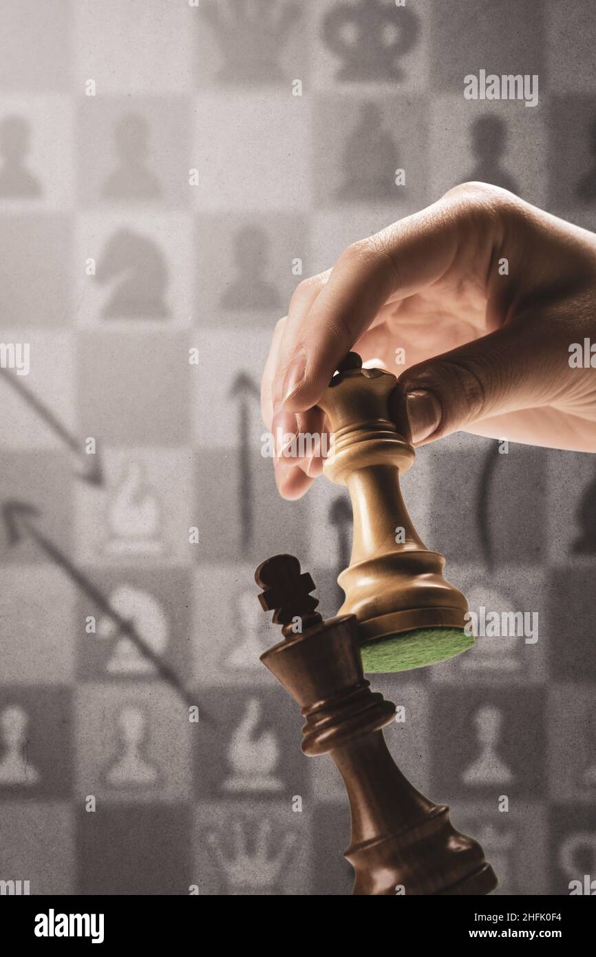 A player is checkmating the king during a chess game: strategy games ...