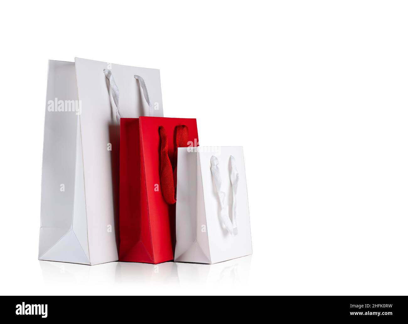 Red Christmas Gift Bag With Tissue Paper Isolated On White