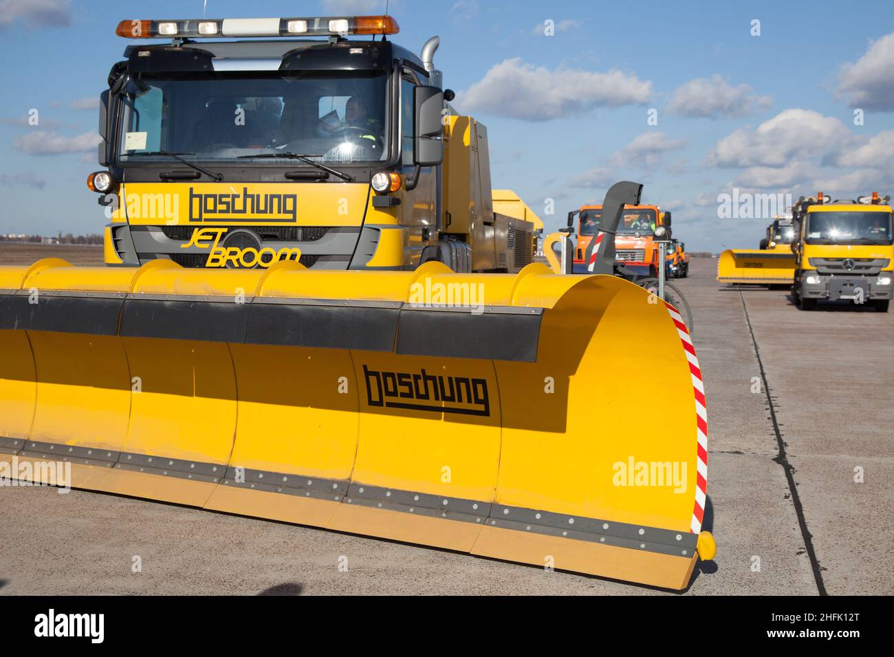 Kyiv, Ukraine - October 29, 2019: BOSCHUNG JETBROOM 9600 snow removal. Multifunctional dump truck cleaning system for airports and highways. Utility machinery -a truck with a large blade and a bucket Stock Photo