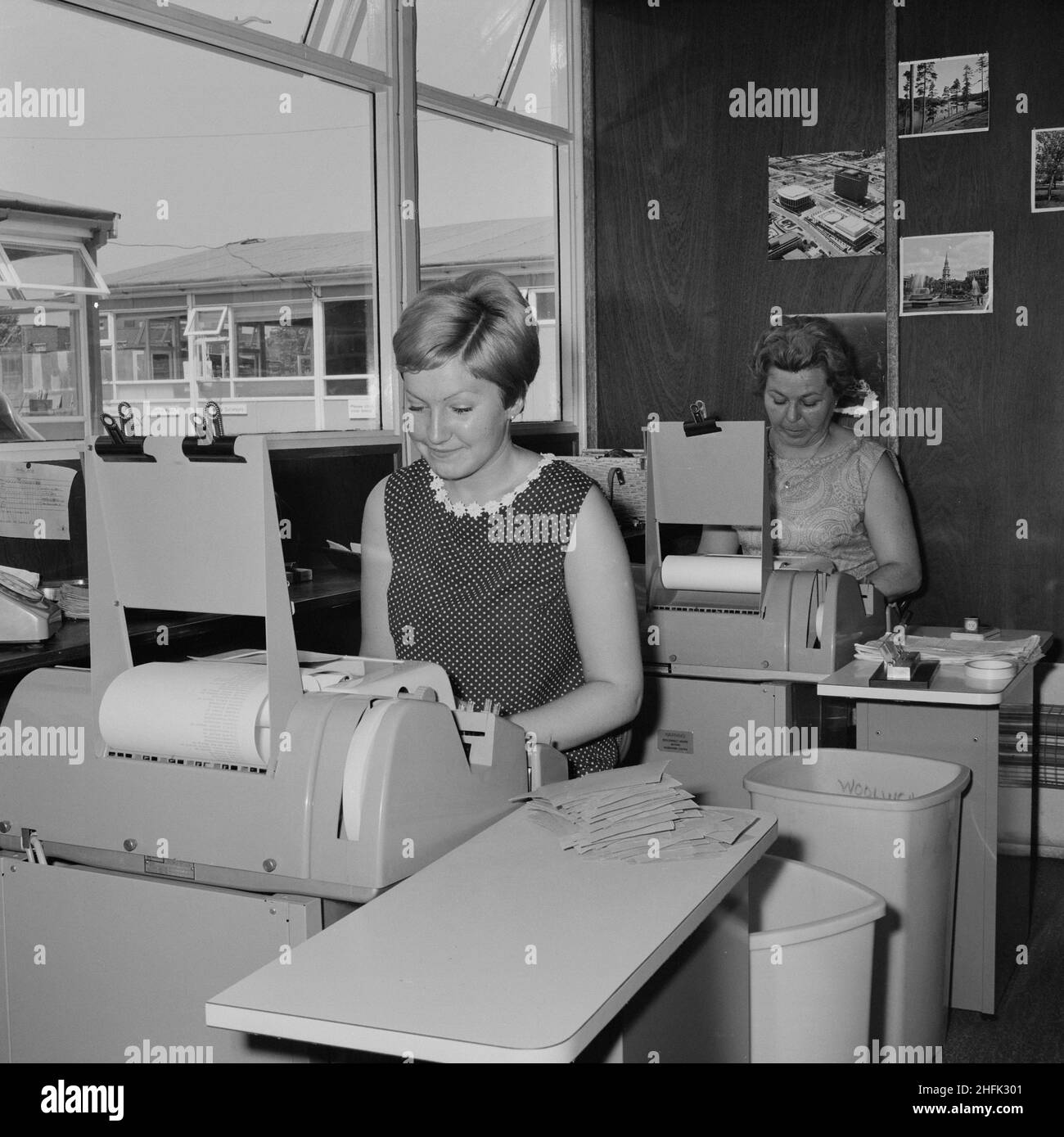 Aylesbury Estate, Walworth, Southwark, London, 28/06/1968. Two women working in the computer room of Laing's construction site at the Aylesbury Estate. In 1963, John Laing and Son Ltd bought the rights to the Danish industrialised building system for flats known as &#x2018;Jespersen&#x2019; (also called 'Jesperson'). The company built factories in Scotland, Hampshire and Lancashire producing Jespersen prefabricated parts and precast concrete panels, allowing the building of housing to be rationalised, saving time and money. Laing's Southern Region started building the Aylesbury Estate in 1967. Stock Photo