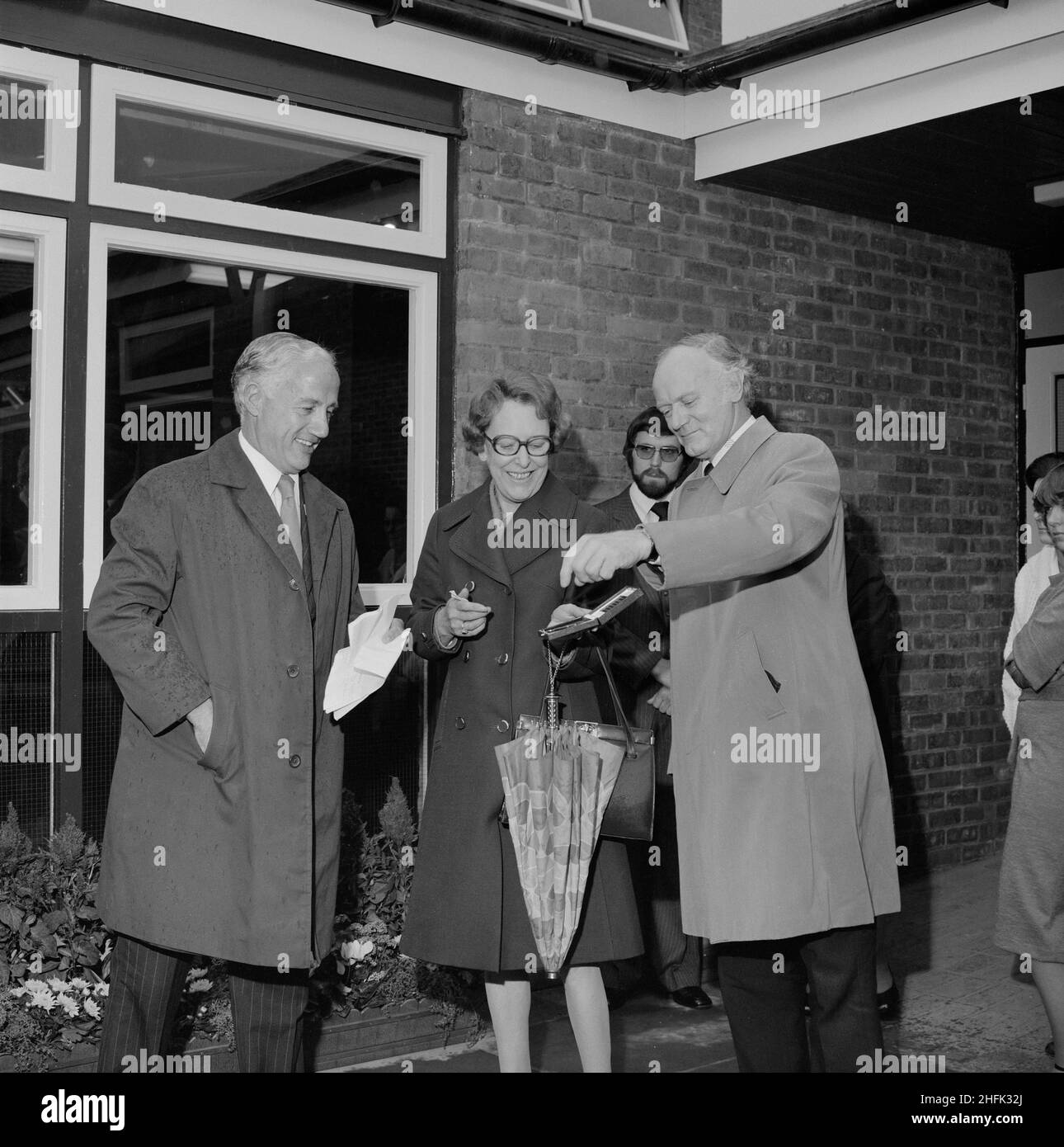 Farriers Hall Community Centre, Farriers Way, Borehamwood, Elstree and Borehamwood, Hertsmere, Hertfordshire, 20/10/1978. F Bryer, Director of Laing's Building Division, presenting Councillor J Tatham with the key to the old people's club on the Furzehill Road housing development. Laing began work on the Furzehill road contract in March 1976. 395 houses and flats would accommodate around 1,400 people. The site was a former 'Home of Rest for Horses,' giving rise to street names like Farriers Way. The contract became an unofficial training ground for apprentices and the old people's club was bui Stock Photo