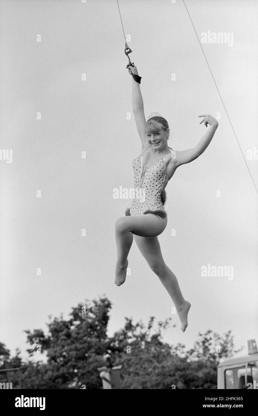 Laing Sports Ground, Rowley Lane, Elstree, Barnet, London, 06/06/1979. A circus acrobat performing an act hanging from a wire during the annual Laing Gala Day at the Elstree Sports Ground. Stock Photo