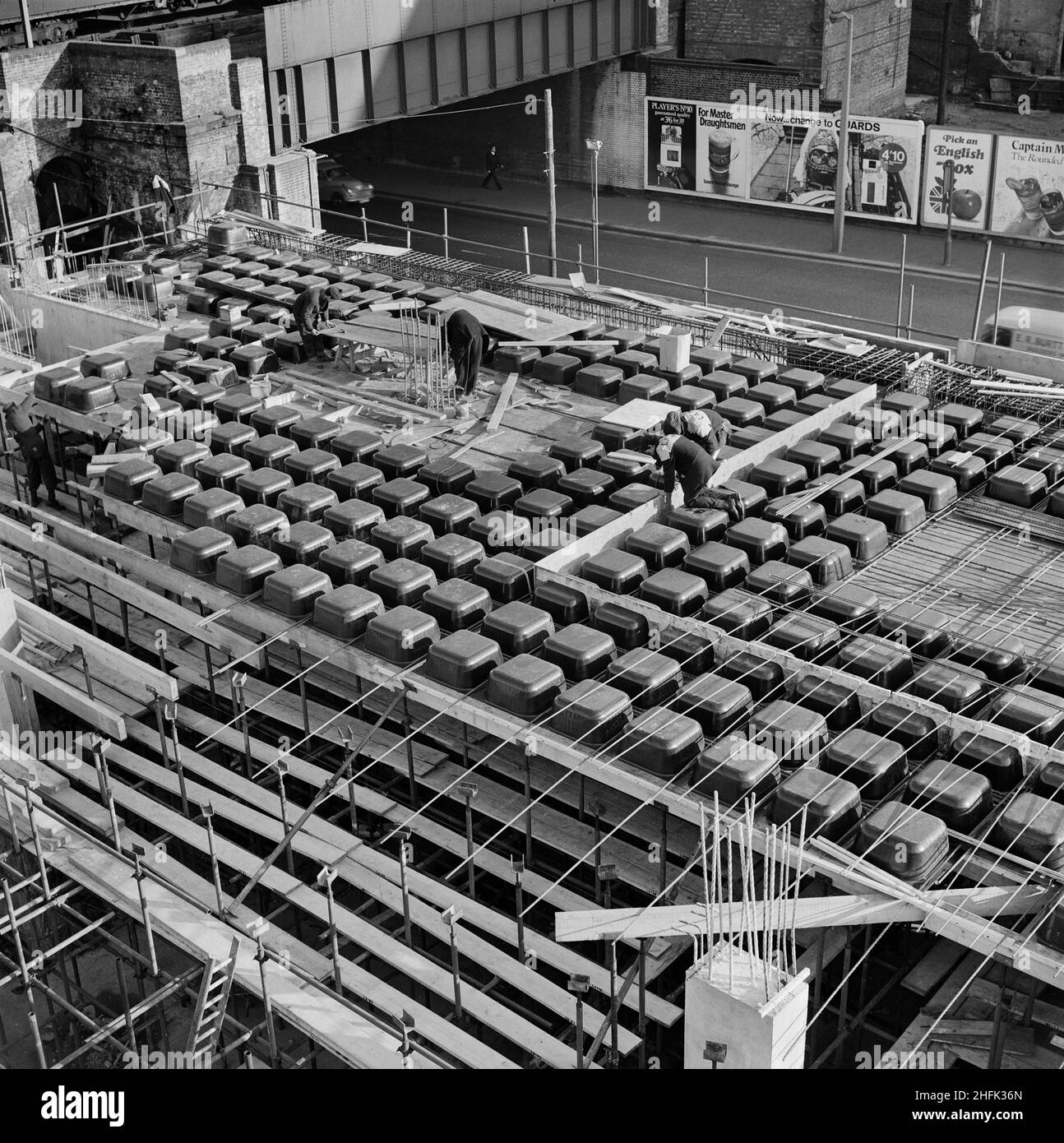 Minories Car Park, 1 Shorter Street, City of London, 31/01/1969. Polypropylene moulds in place to create the coffered structure of the floor slab of the first floor at Minories Car Park. In Team Spirit, the Laing company newsletter, these are referred to as 'Kaiser Moulds.' 2,200 of these were hired for the project and all but one of them were returned intact. At this stage of the project, the site team poured 300 cubic yards of concrete per week. Stock Photo