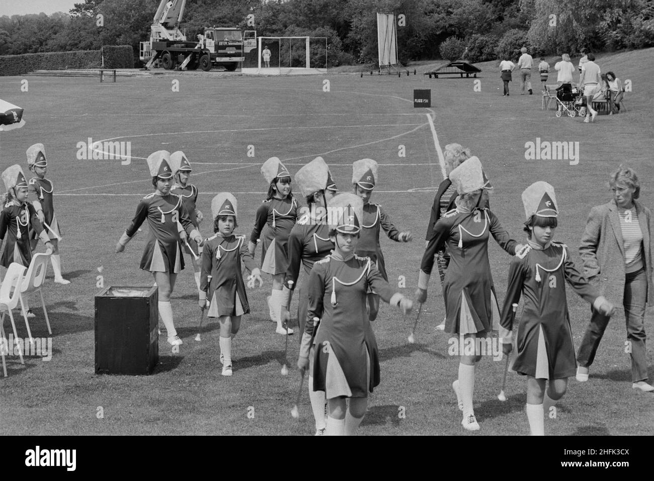 Laing Sports Ground, Rowley Lane, Elstree, Barnet, London, 30/06/1984. A troop of drum majorettes march away from the football pitch after their performance for Gala Day at Laing's Elstree Sports Club. Stock Photo