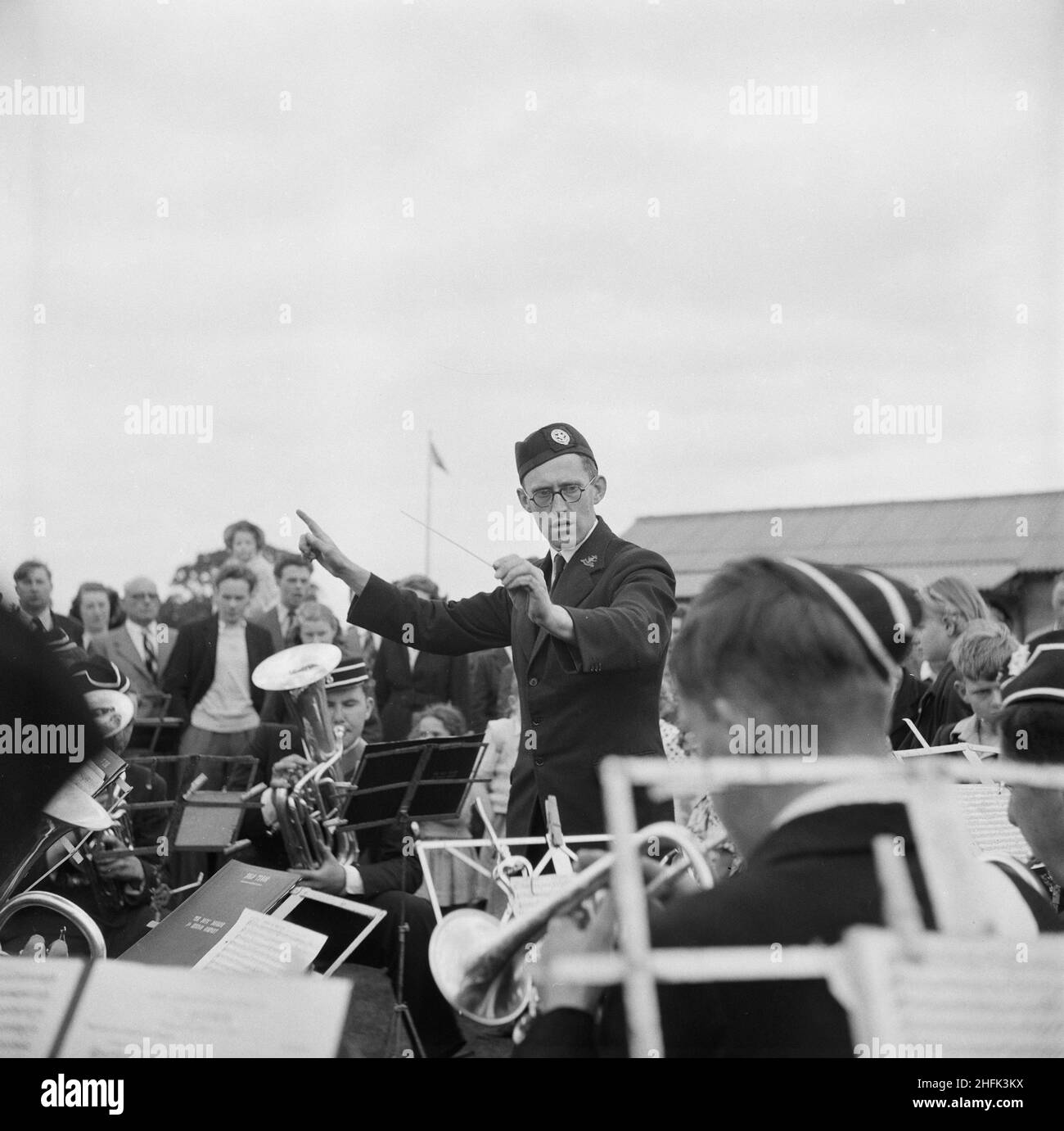 Laing Sports Ground, Rowley Lane, Elstree, Barnet, London, 27/06/1953. A man conducting a brass band during a sports meeting held at Laing's Sports Club in Elstree. Stock Photo