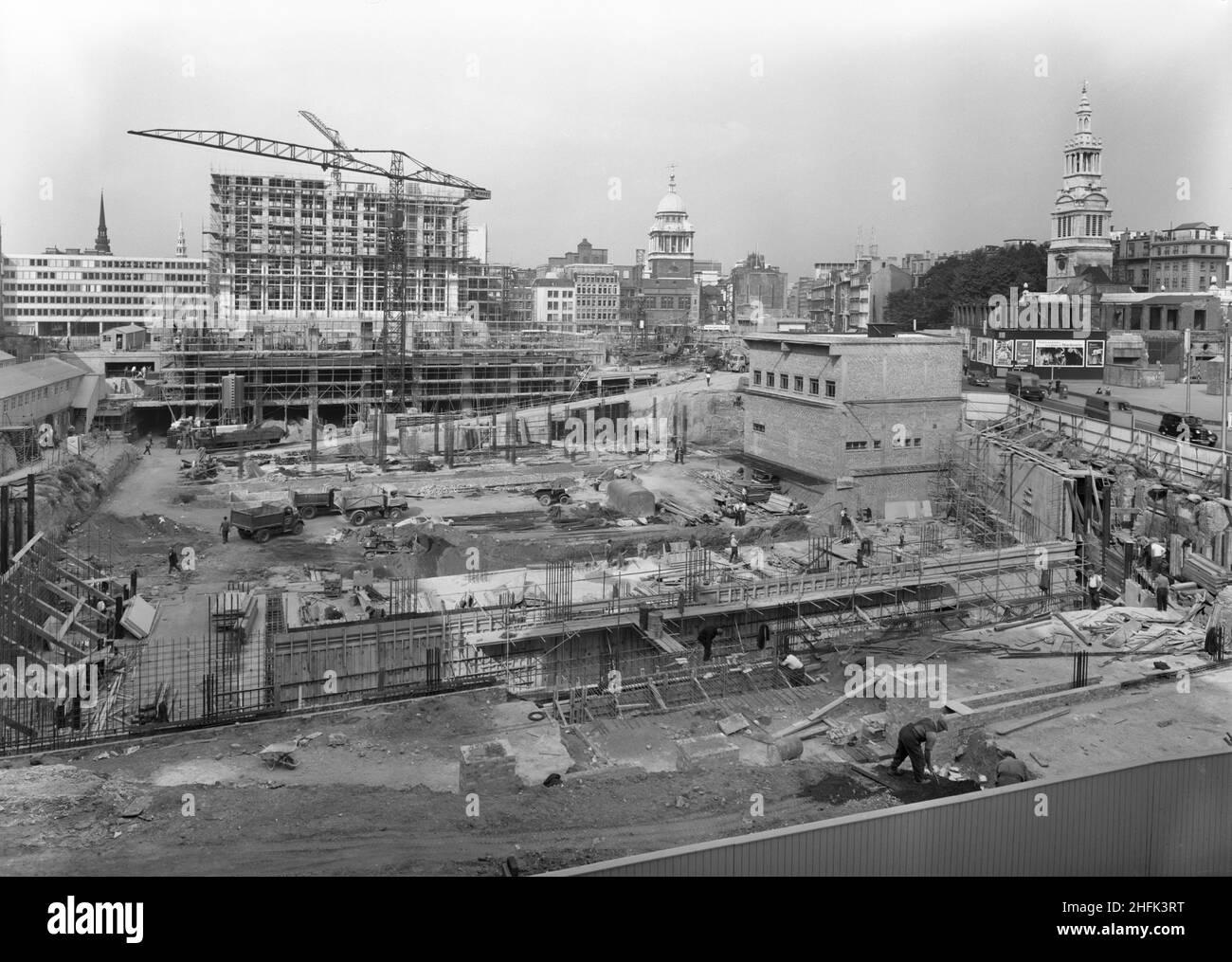 Paternoster Square, City of London, 03/09/1962. Looking west over the Paternoster development during its construction, showing the Old Bailey in the background and Christchurch Greyfriars on the right. Work on the Paternoster development was carried out in a joint venture by John Laing Construction Limited, Trollope and Colls Limited, and George Wimpey and Company Limited. The scheme involved the redevelopment of a seven acre site on the north side of St Paul&#x2019;s Cathedral. The site had been almost entirely devastated during an incendiary raid in December 1940. The development consisted o Stock Photo