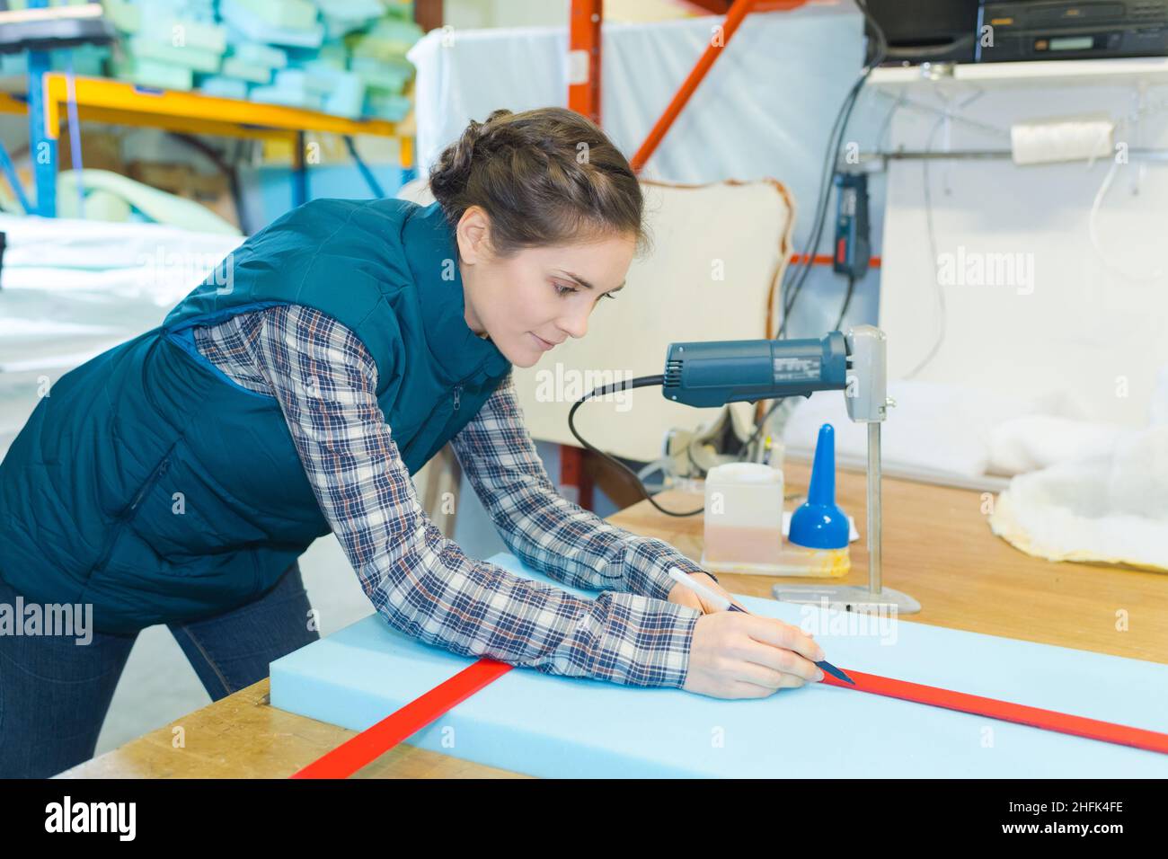 worker measuring a foam Stock Photo