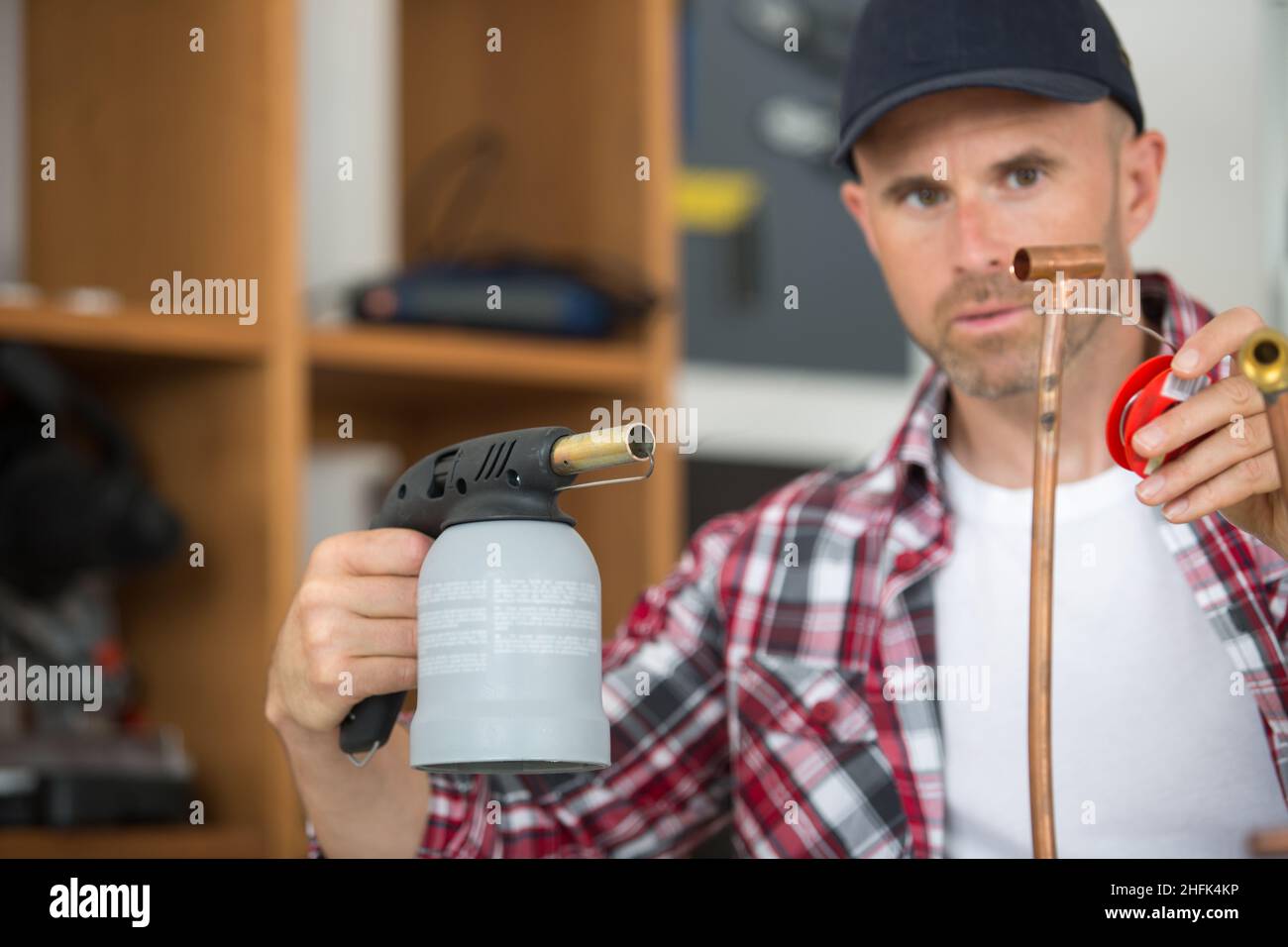 worker using blowtorch for soldering copper fittings Stock Photo Alamy