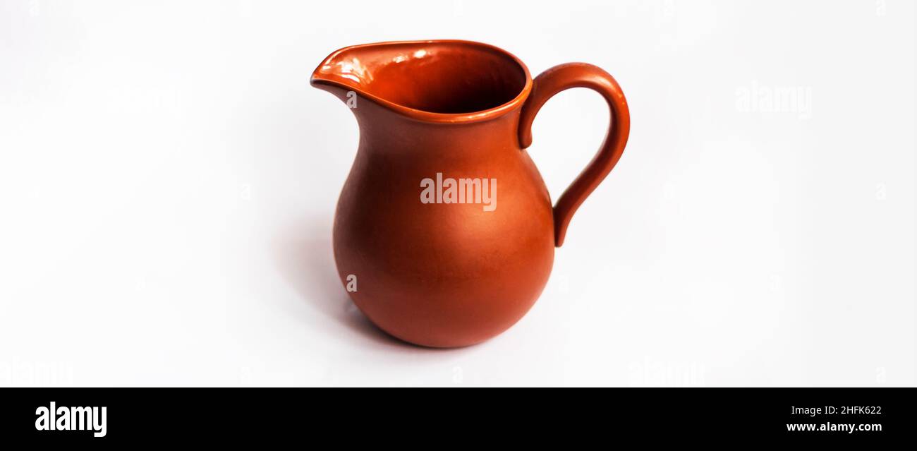 clay jug for milk on a white background Stock Photo