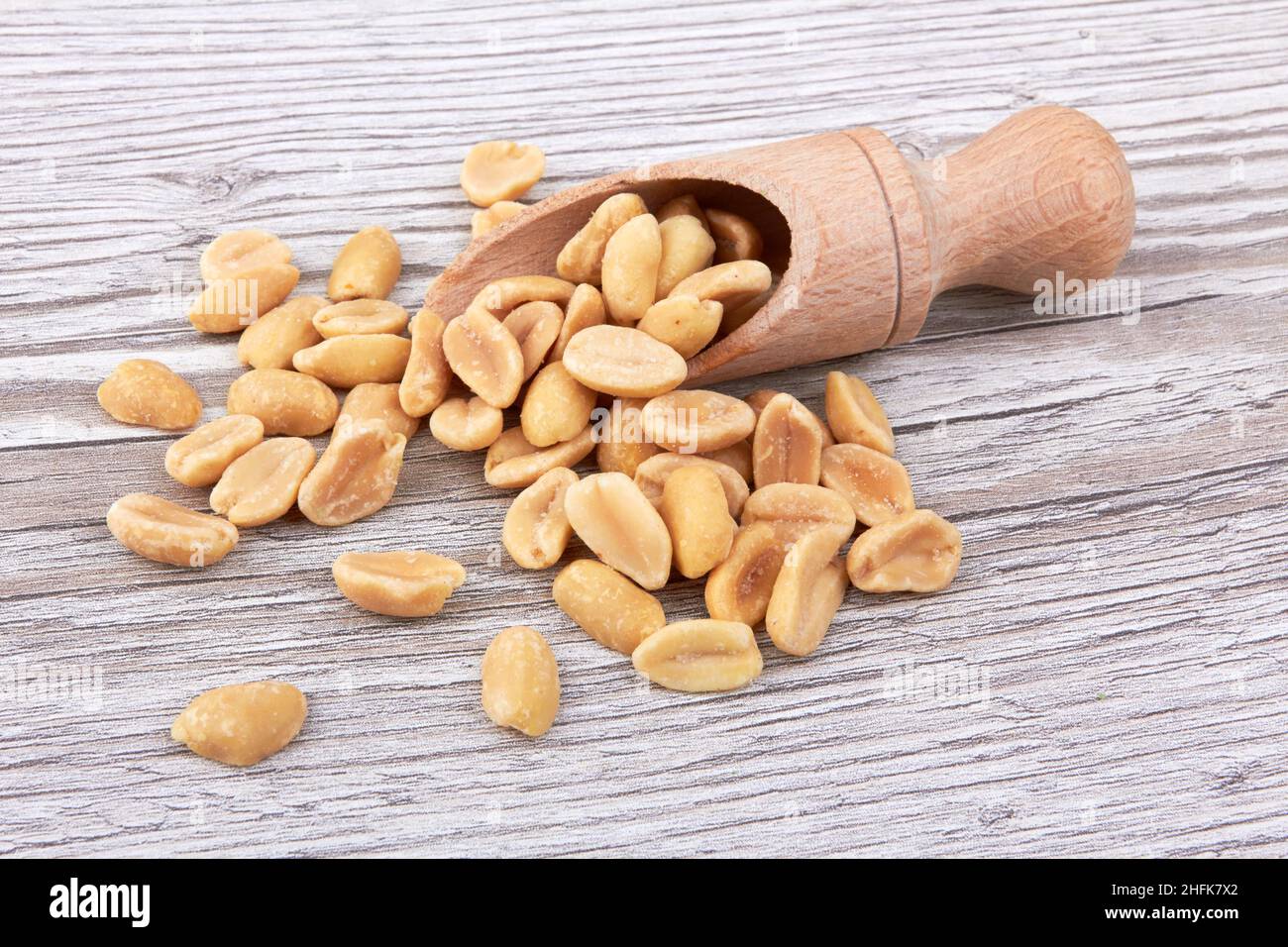 Salted peanuts on a wooden background Stock Photo