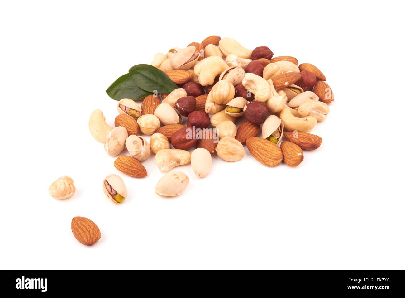 Heap of mixed nuts isolated on white background Stock Photo