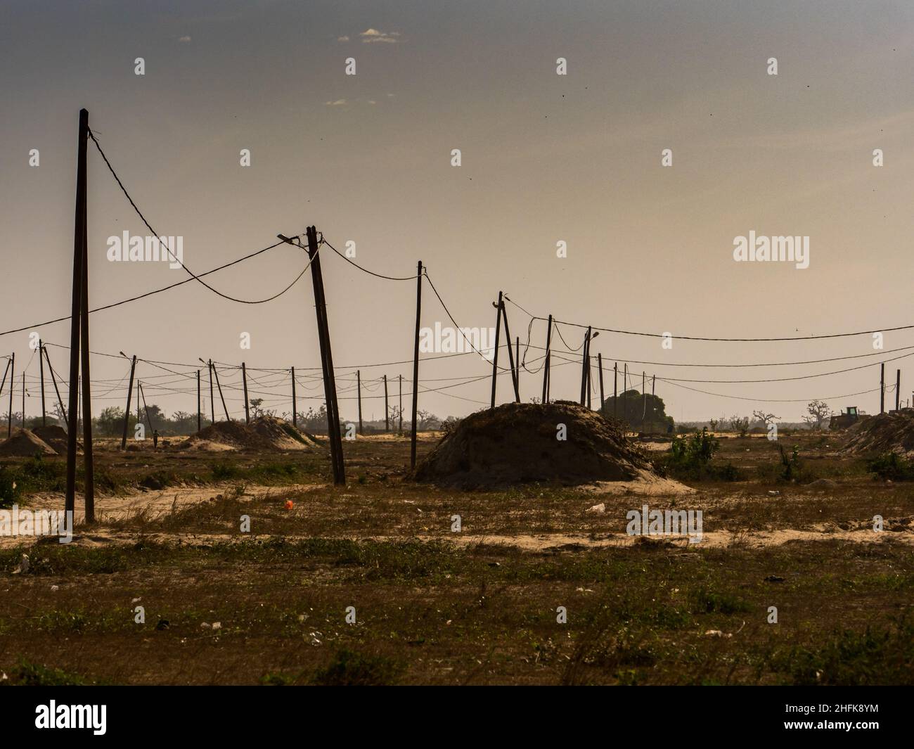 Electric pylons in a field in the suburbs of Dakar, Senegal, Africa. Stock Photo